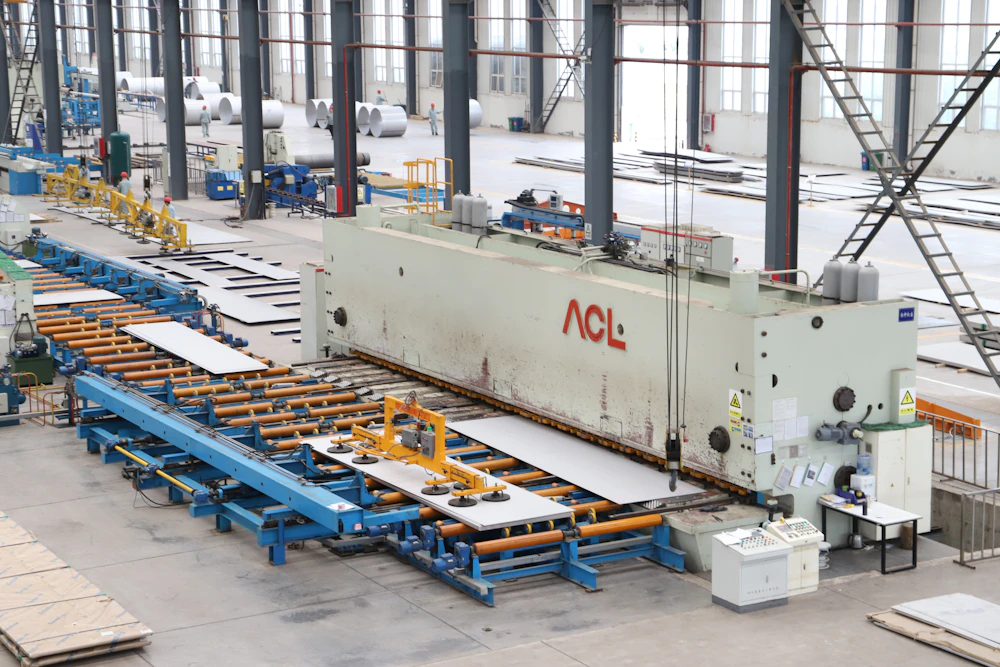 Sheet-metal machinery and materials on a factory floor
